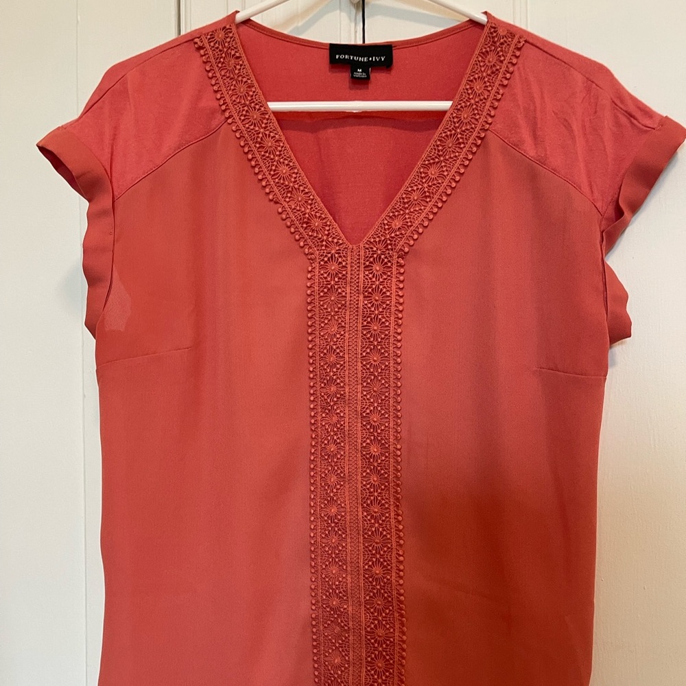V-neck blouse 
Beaded accents, Embroidered detail, Shiny accents